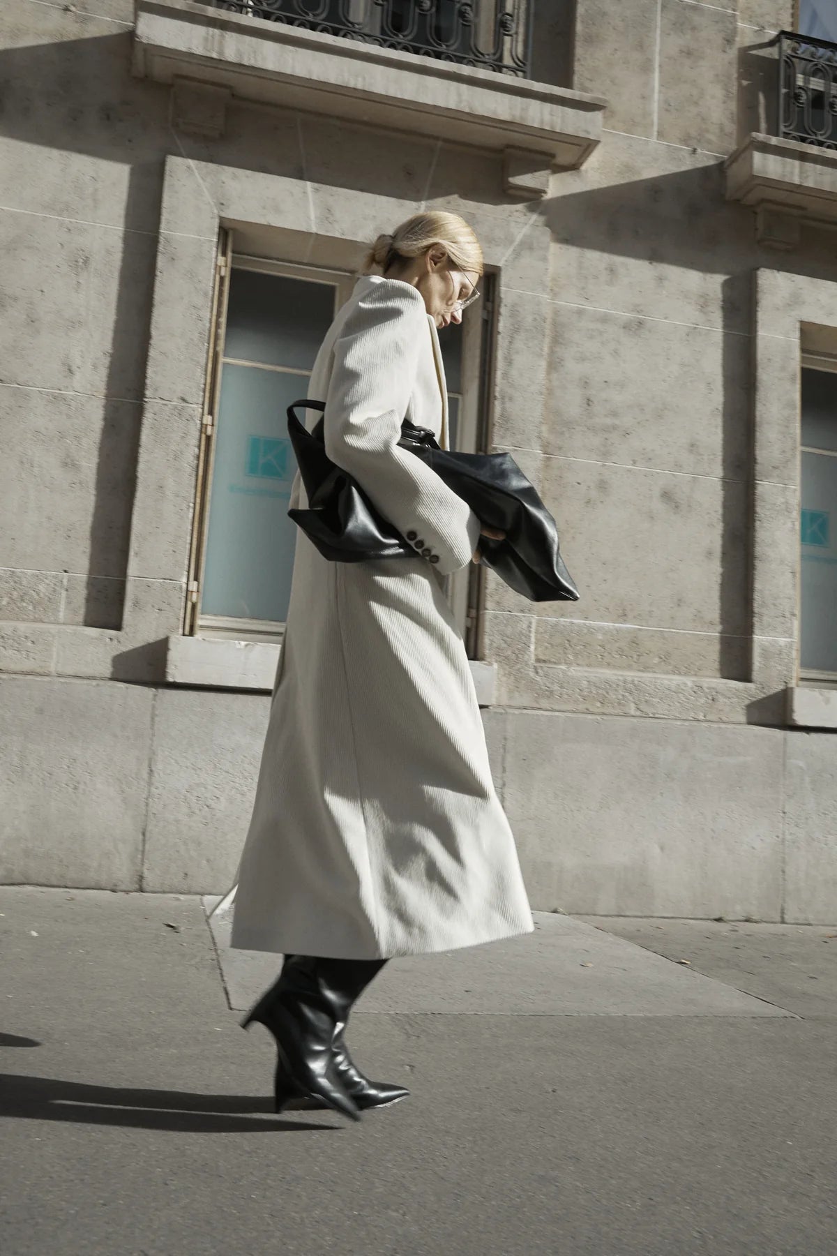 White long coat side view showing hem and shoe balance