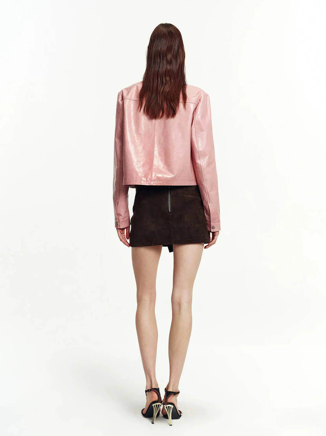 Pink lambskin cropped leather moto jacket back view on model