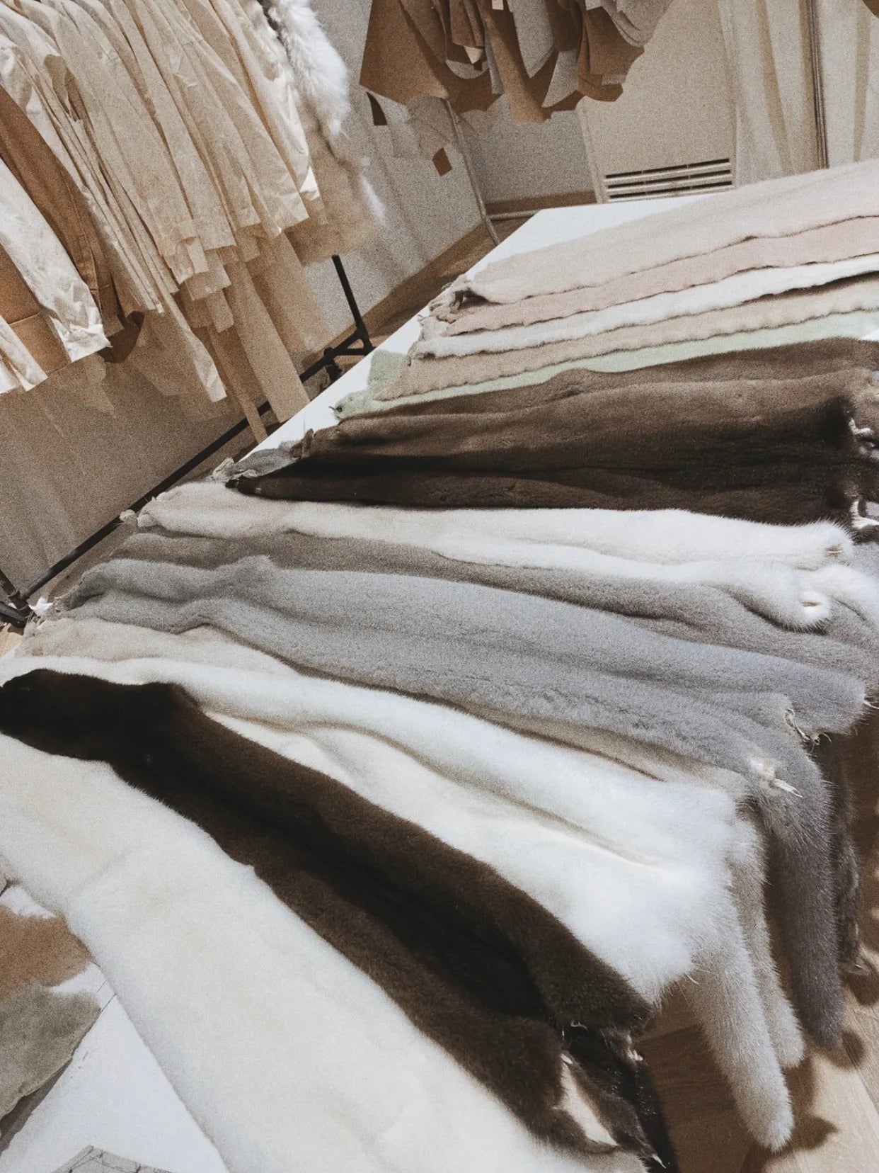 Fur pieces arranged on a studio table used to show disciplined final buying judgment