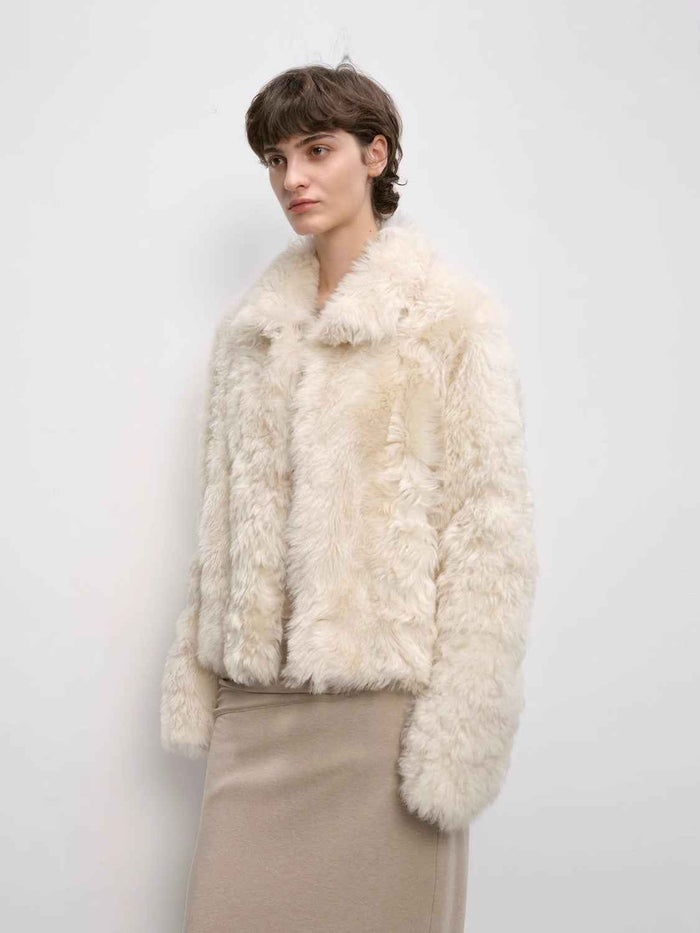 Black short wool sheepskin coat visual for material-specific care path
