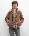 Woman wearing the Florence macchiato shearling fox fur collar coat, front view
