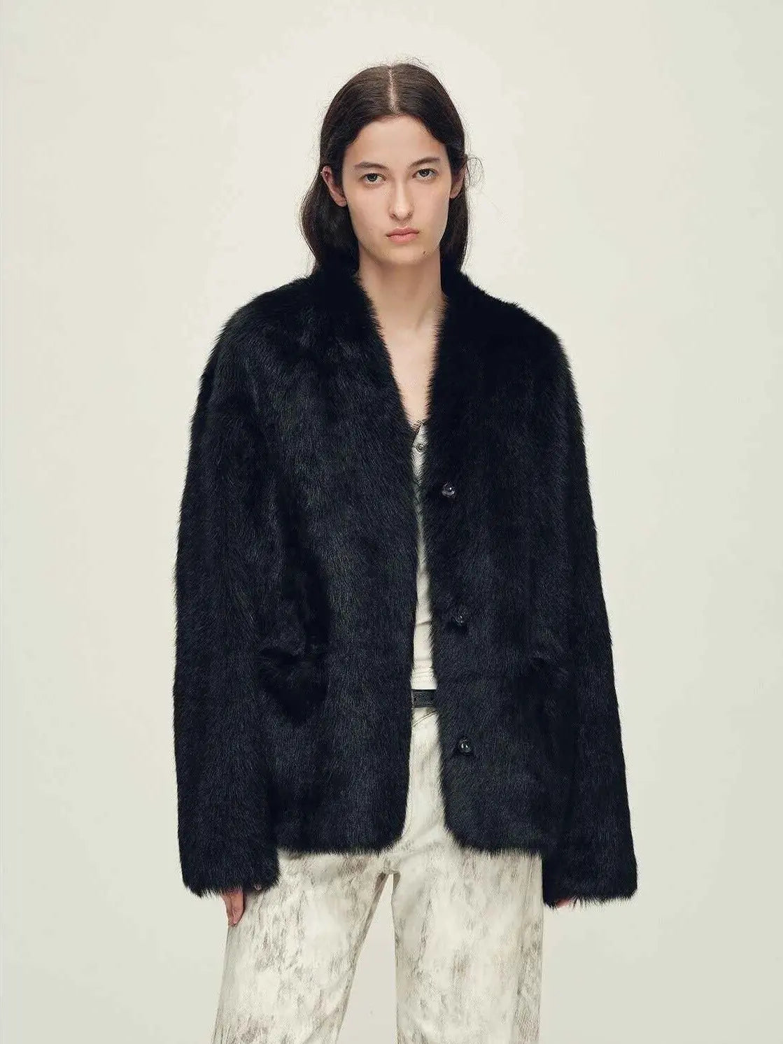 Woman wearing the Freezing Point Rum black Toscana shearling V-neck coat