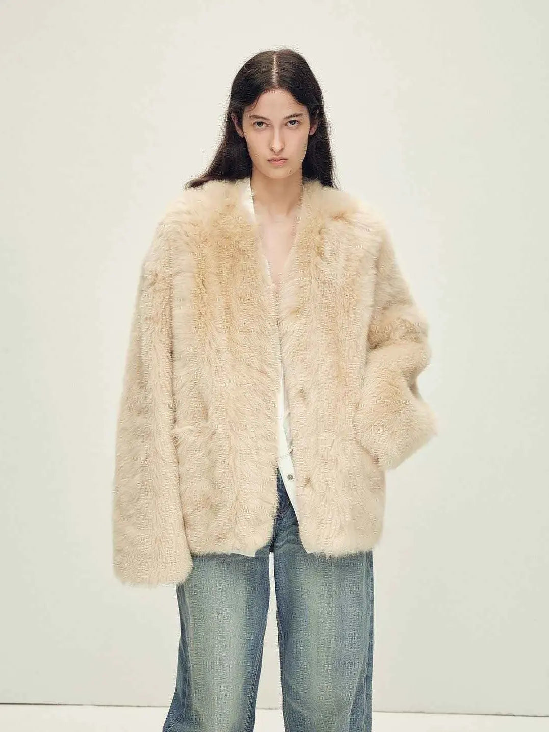Woman wearing the Freezing Point Rum flax rice Toscana shearling V-neck coat