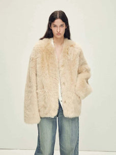 Woman wearing the Freezing Point Rum flax rice Toscana shearling V-neck coat