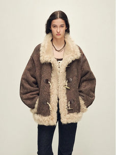 Model wearing the Galaxy Gala fog brown Merino shearling coat, front view