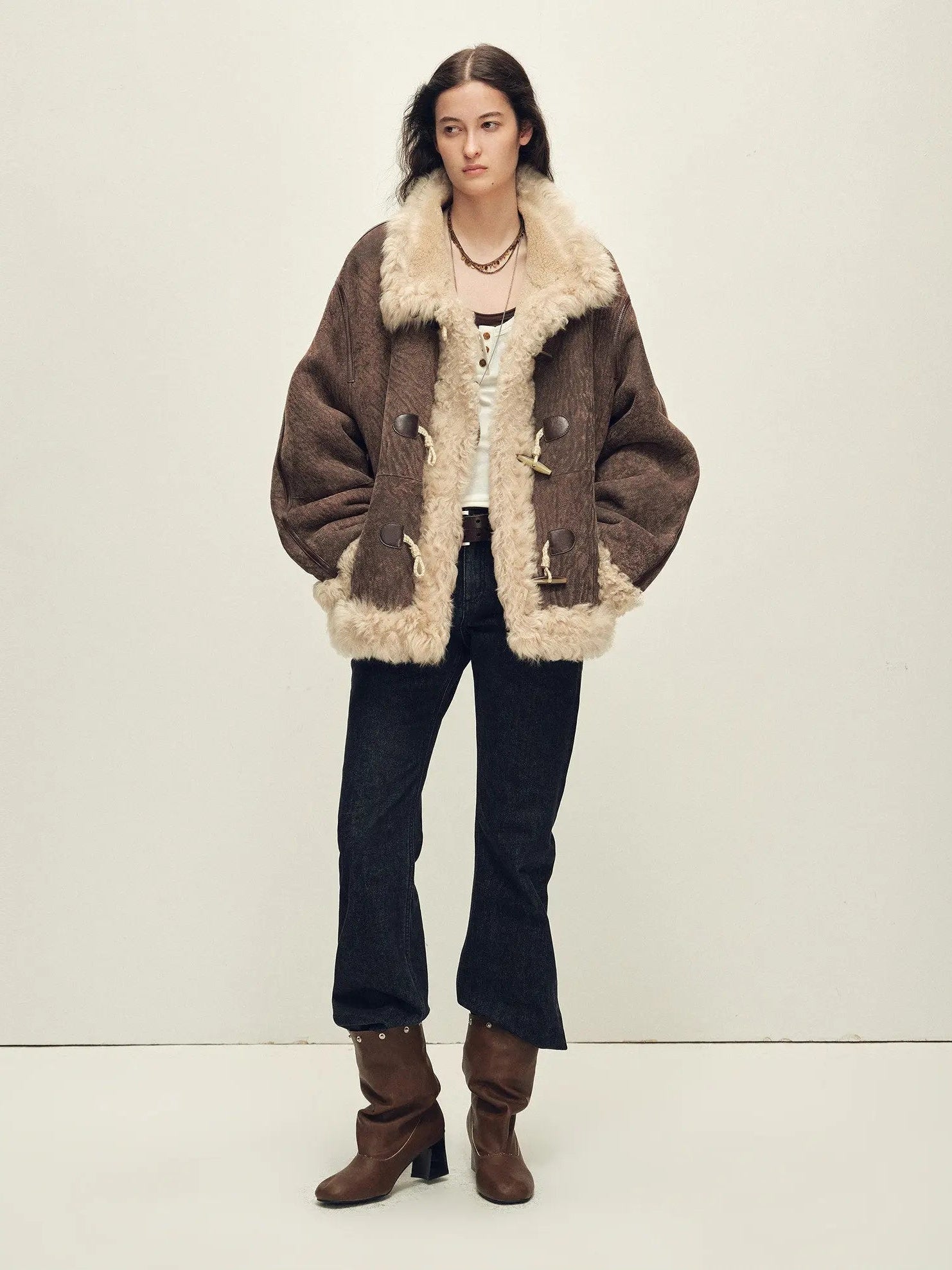 Model wearing the Galaxy Gala fog brown Merino shearling coat, full-length view