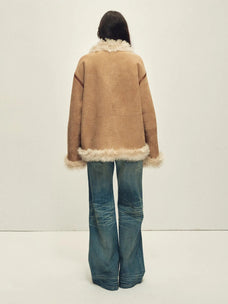 Model wearing the Galaxy Gala tortoiseshell yellow Merino shearling coat, back view