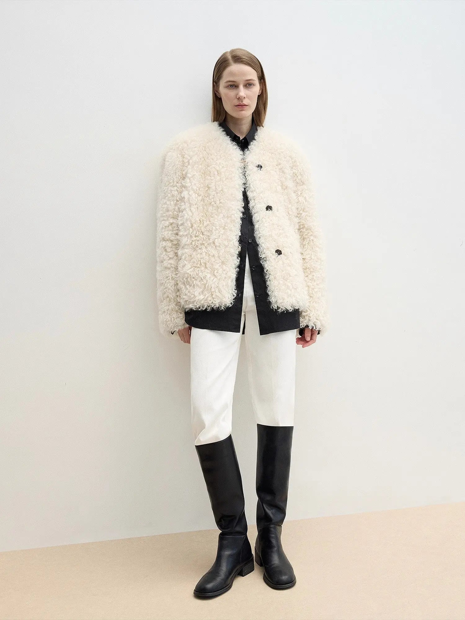 Ghost Horse Girl Merino curly shearling coat styled with black knee boots