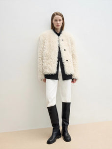 Ghost Horse Girl Merino curly shearling coat styled with black knee boots