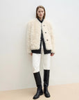 Ghost Horse Girl Merino curly shearling coat styled with black knee boots
