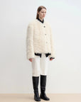 Off-white Merino curly shearling jacket, full-length side angle