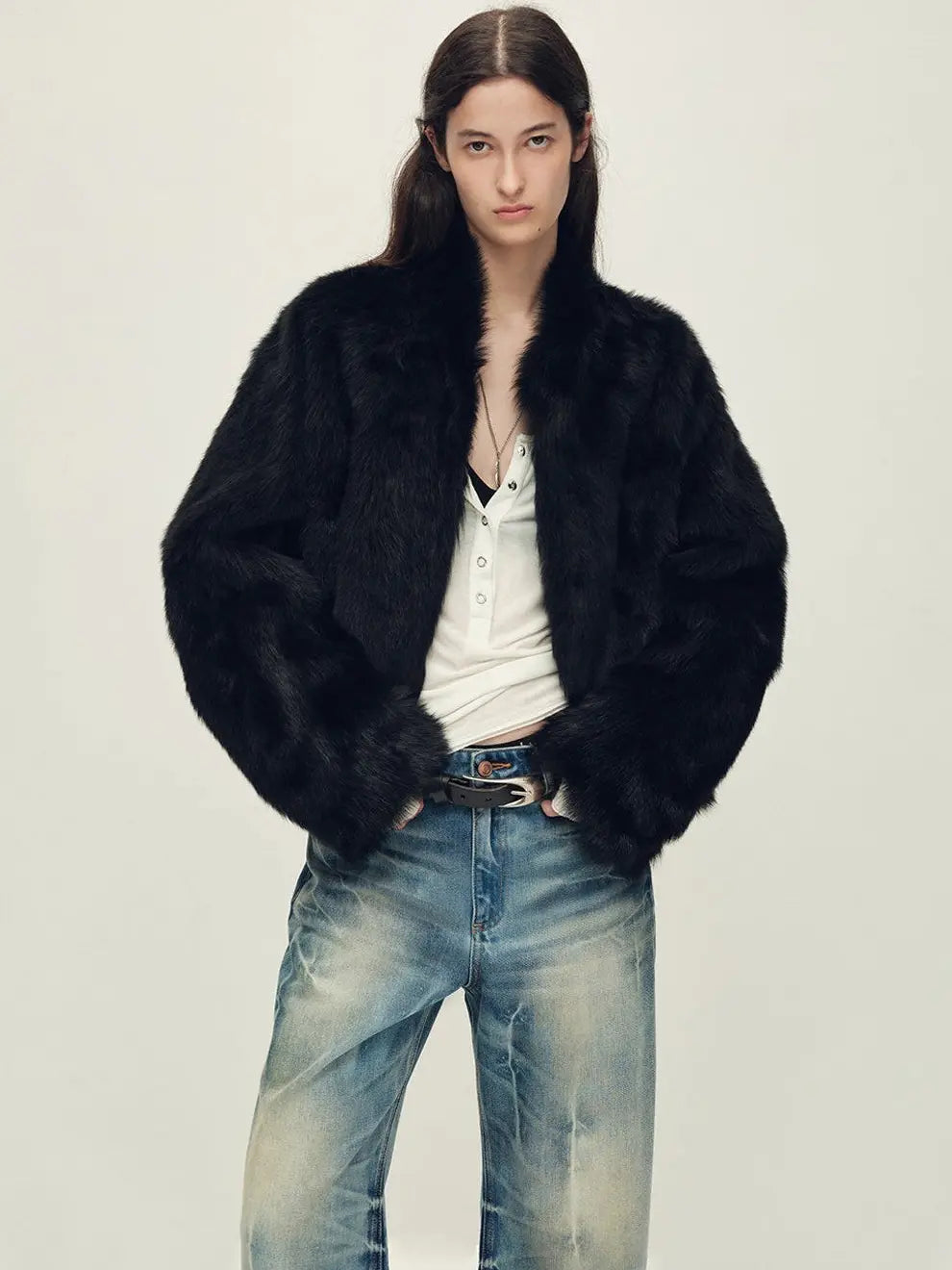 Woman wearing the Healing Eros black Toscana shearling coat, front view