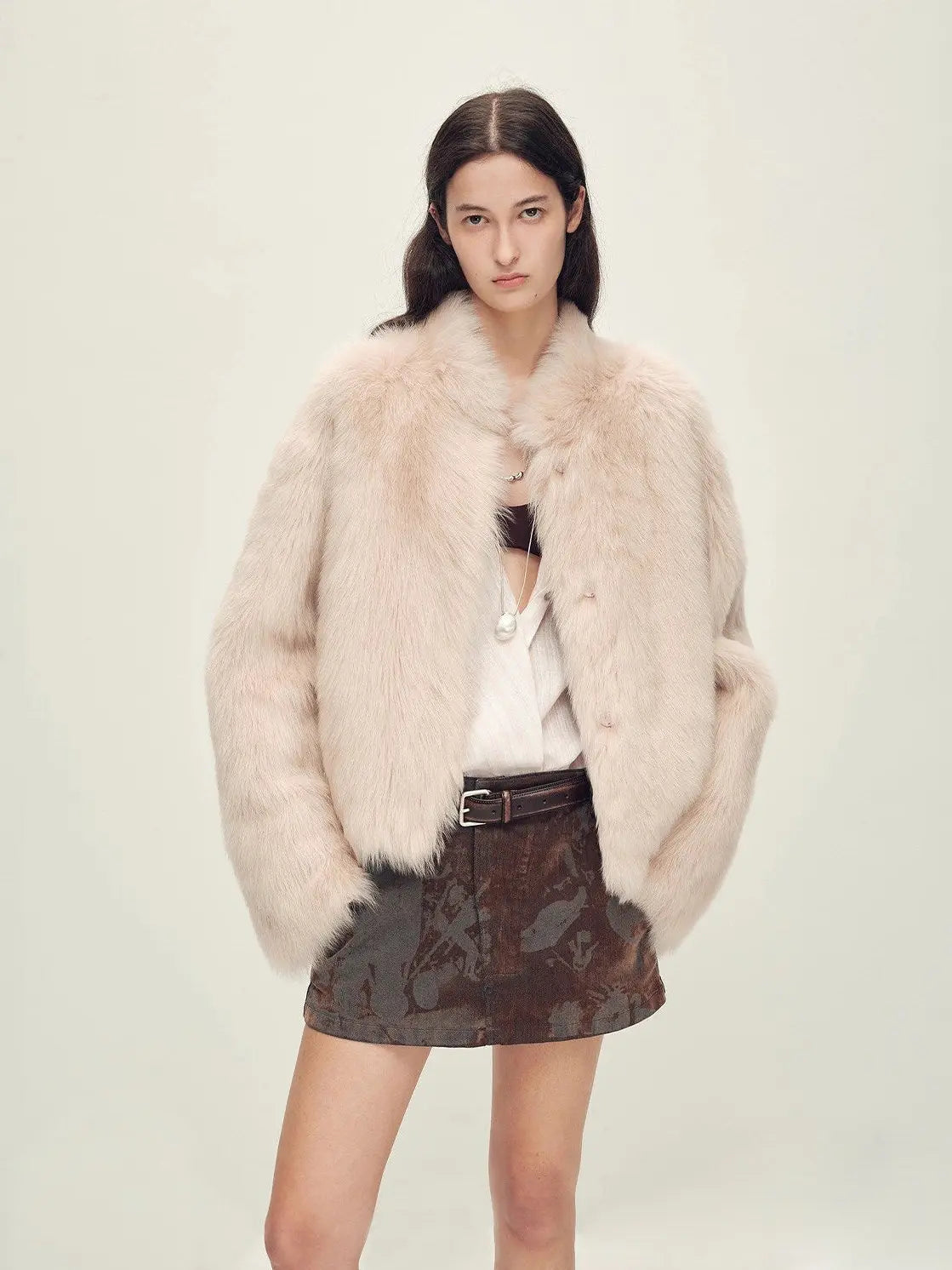 Woman wearing the Healing Eros dirty pink Toscana shearling coat, front view
