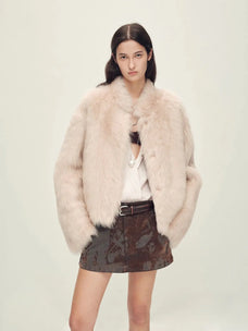 Woman wearing the Healing Eros dirty pink Toscana shearling coat, front view