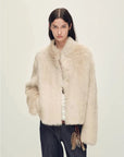 Woman wearing the Healing Eros wheat field Toscana shearling coat, front view