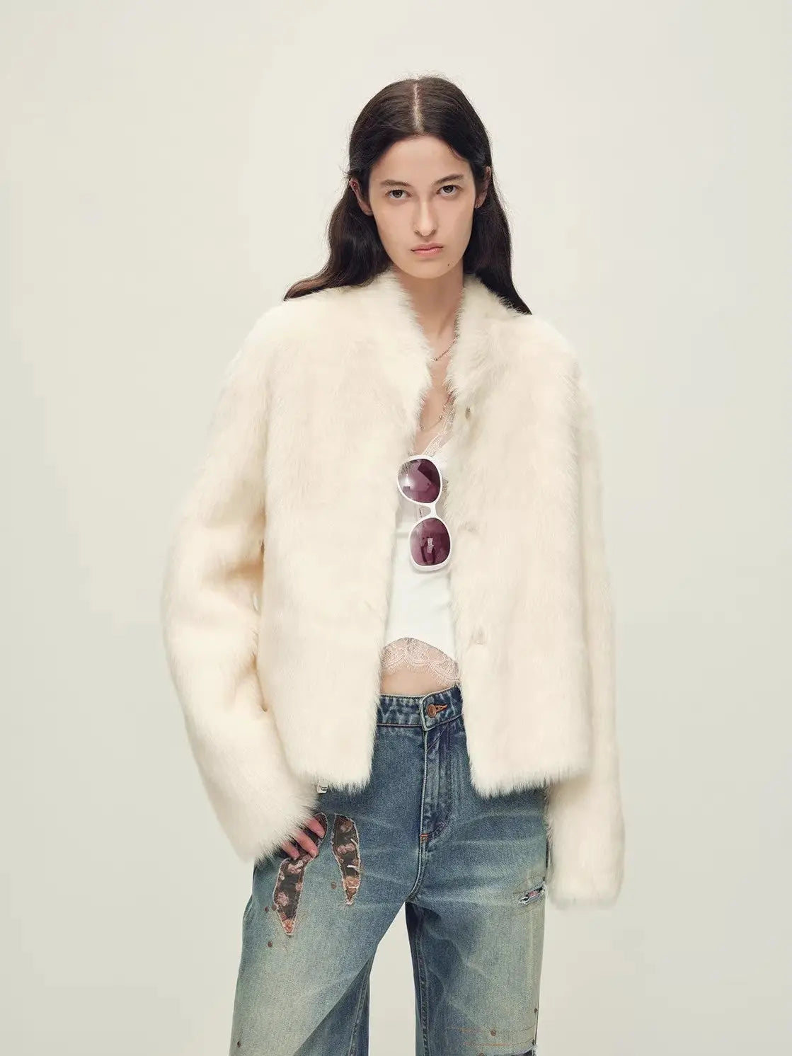 Woman wearing the Healing Eros white Toscana shearling coat, front styling view
