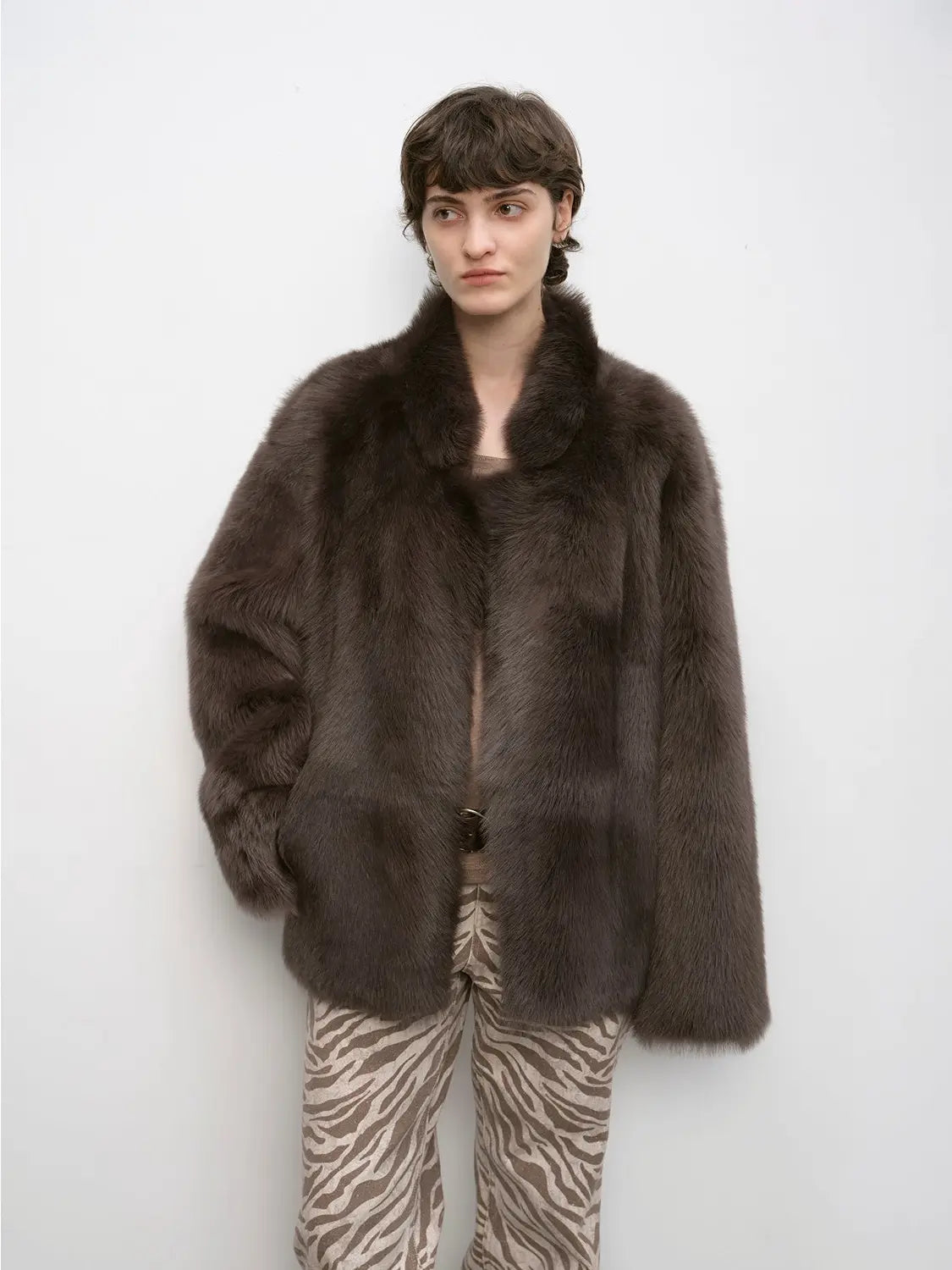 Woman wearing the Heartbeat Mark dark brown Toscana shearling coat, front view