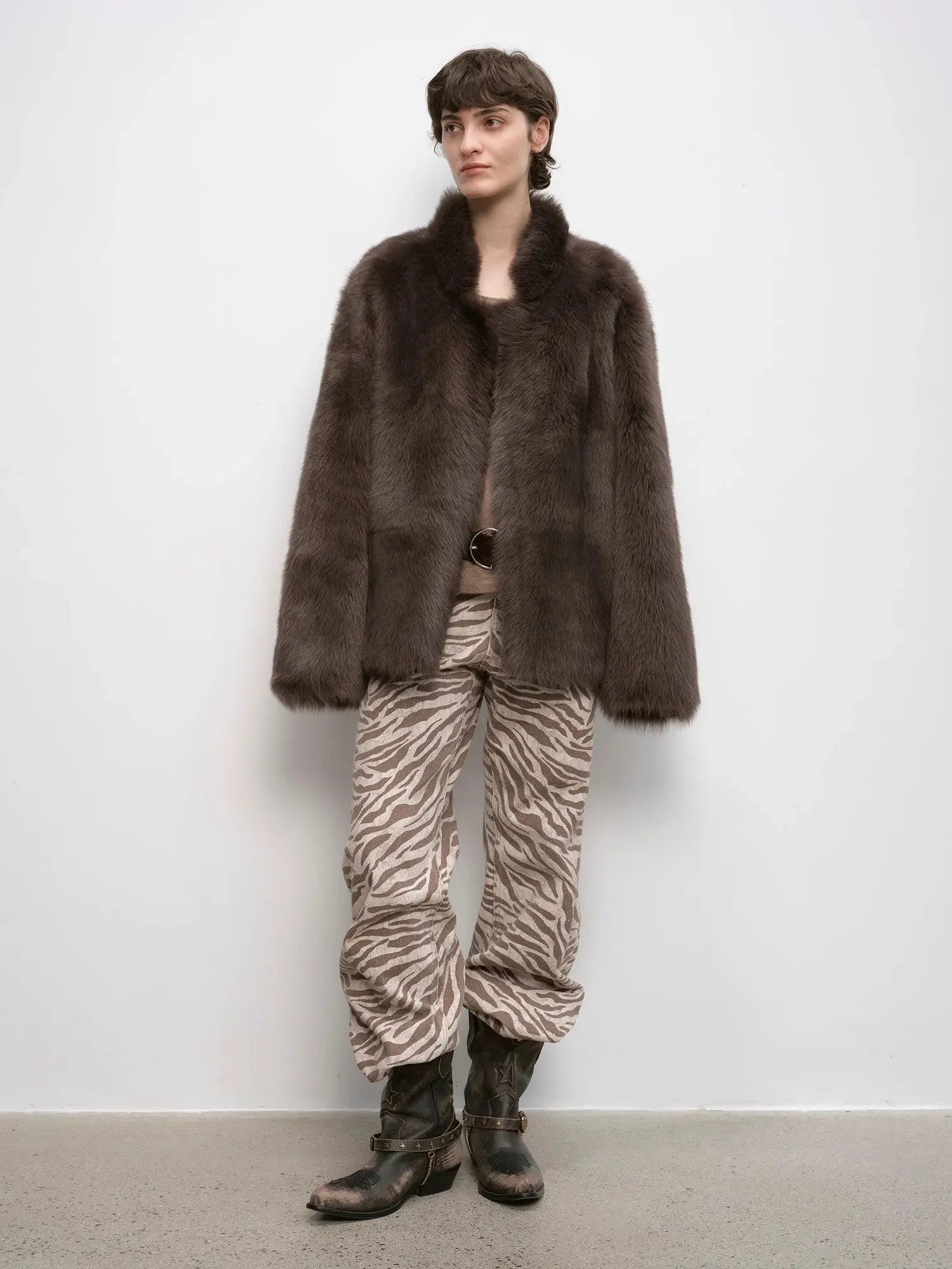 Woman styling the Heartbeat Mark dark brown Toscana coat, full-length view