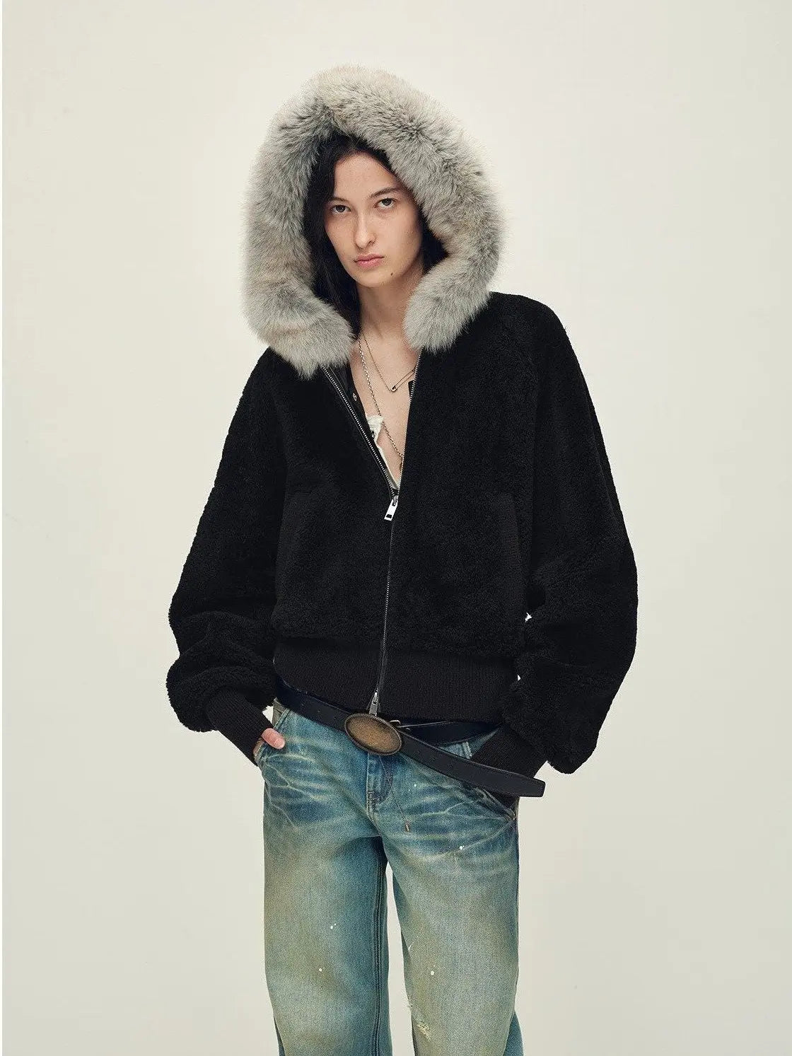 Model wearing Hokkaido Melody black short hooded Merino shearling jacket