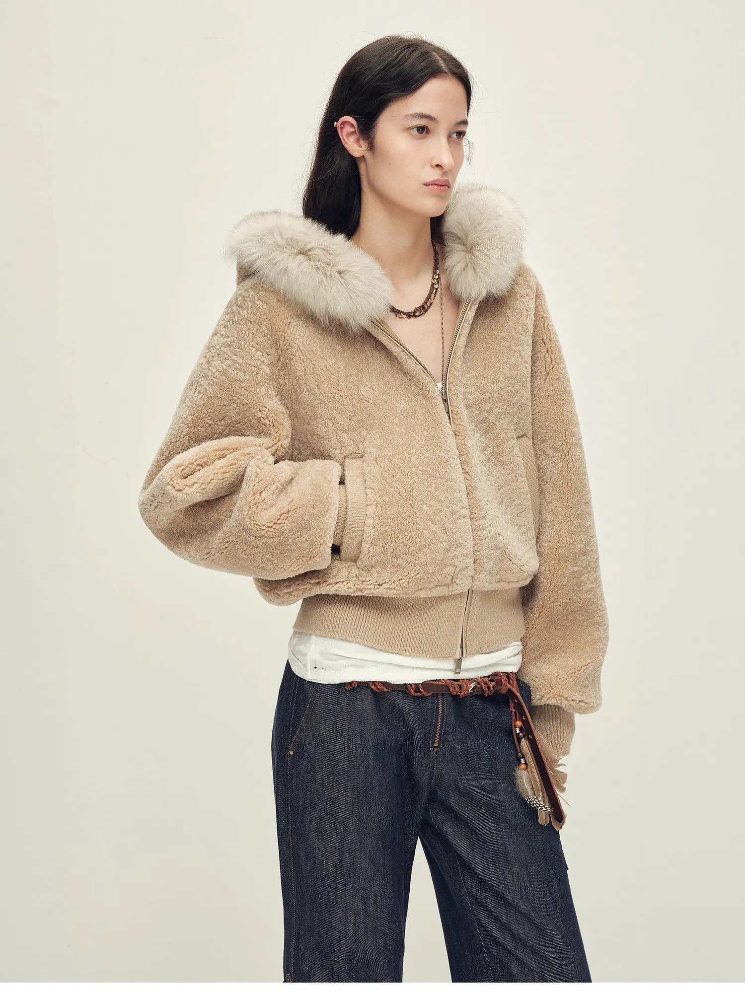 Model wearing Hokkaido Melody camel short hooded Merino shearling jacket, front view