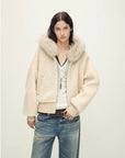 Model wearing Hokkaido Melody off-white short hooded Merino shearling jacket