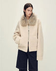 Model wearing Hokkaido Melody off-white short collar Merino shearling coat