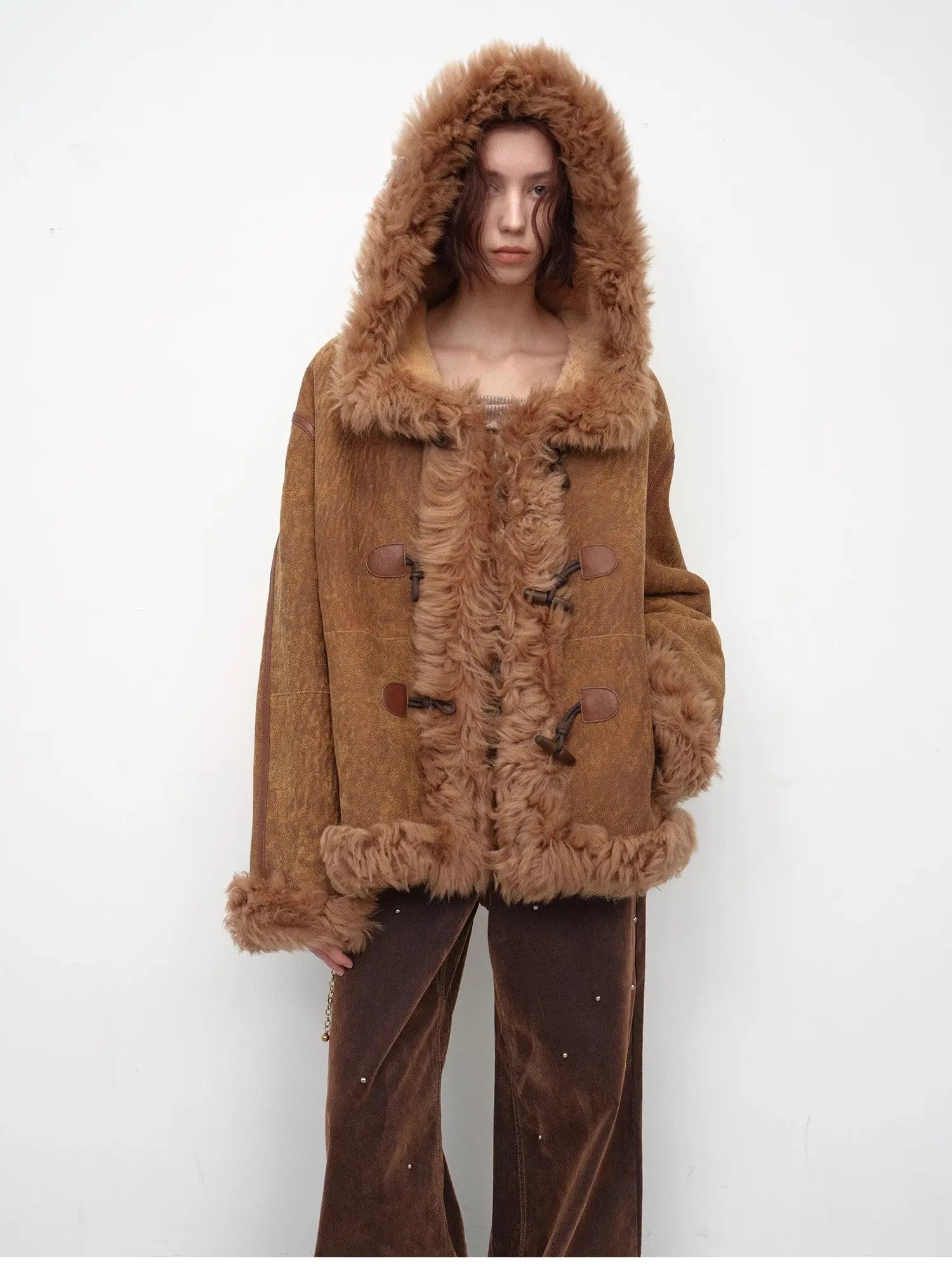 Model wearing the camel hooded Merino shearling jacket, view 2
