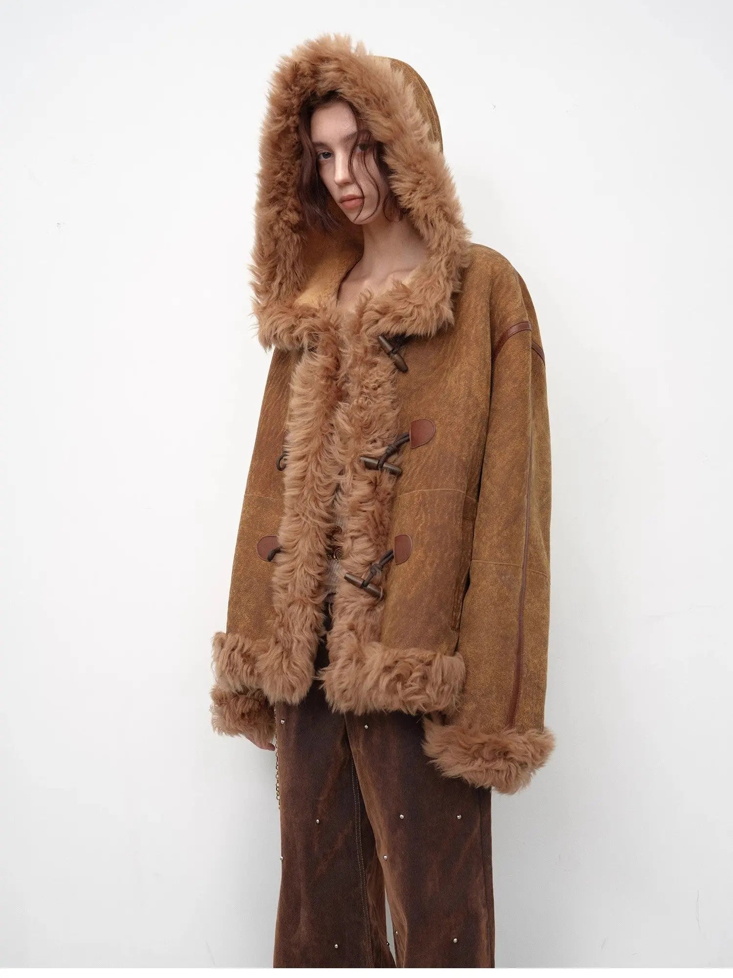 Model wearing the camel hooded Merino shearling jacket, view 3