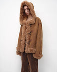 Model wearing the camel hooded Merino shearling jacket, view 3