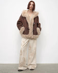 Model wearing the fog brown hooded Merino shearling jacket, view 4