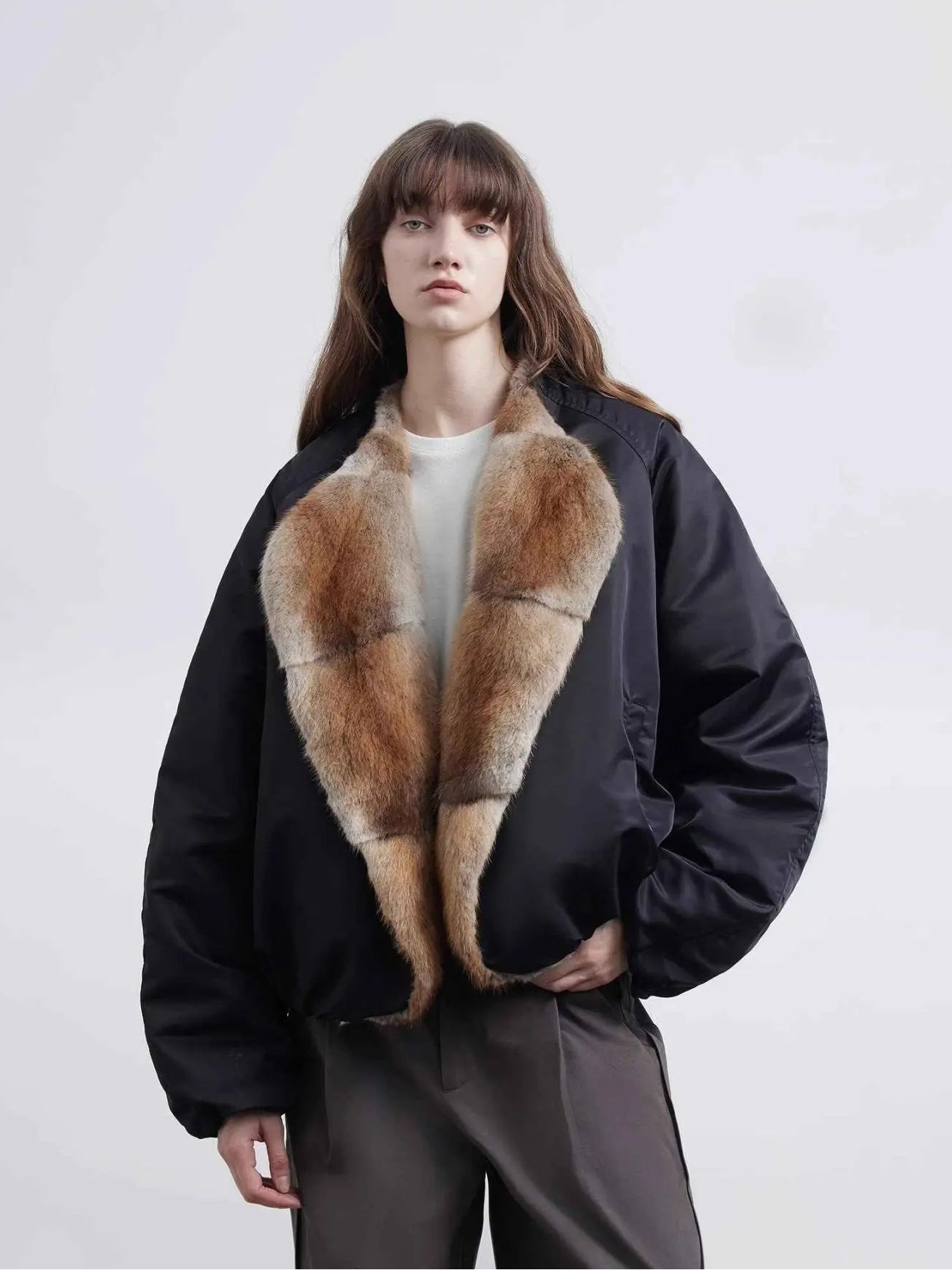 Model wearing Fireladyfur Hull Contract Classic Black sable muskrat fur down parka front view