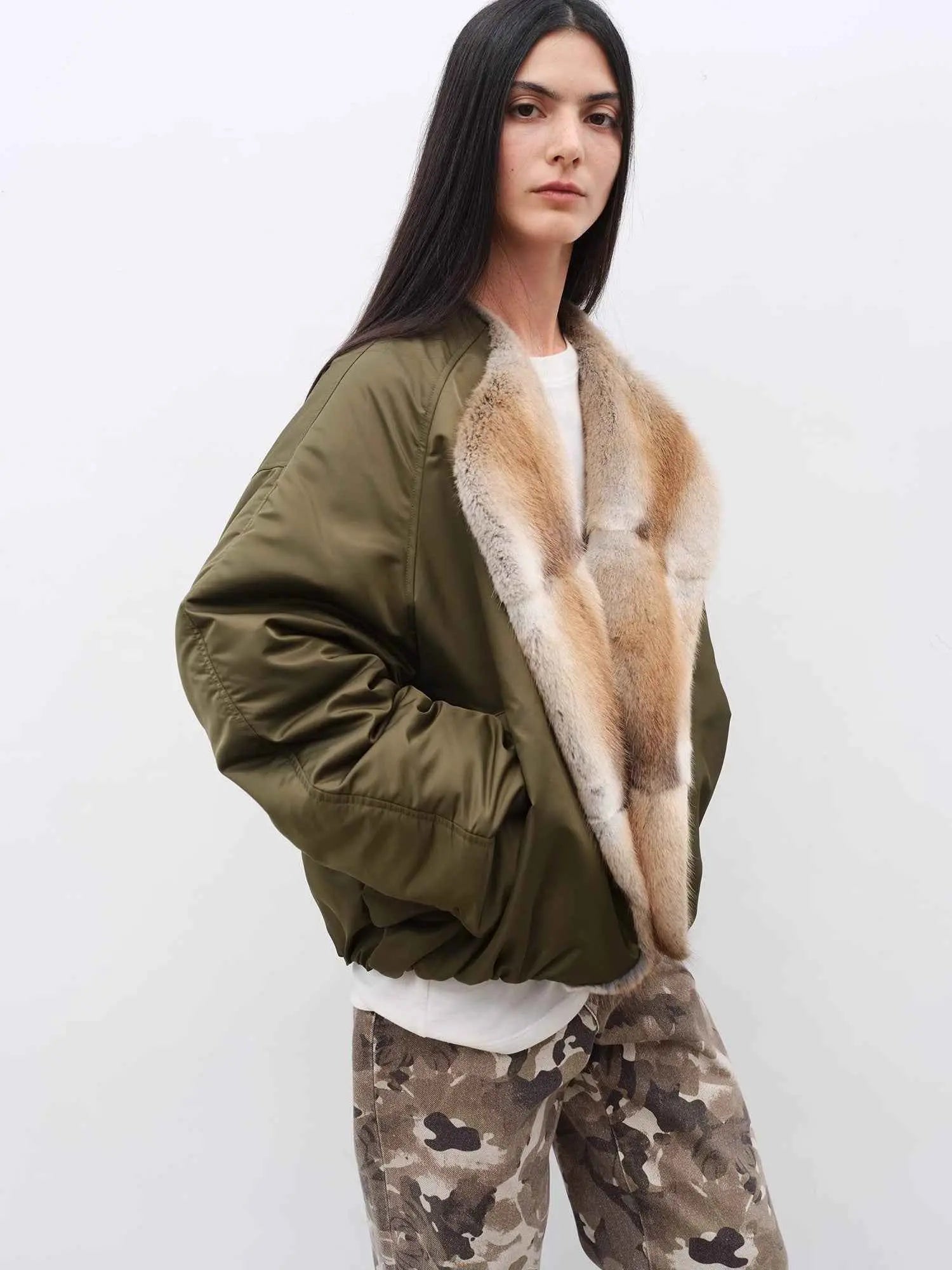 Three-quarter model view of Fireladyfur Hull Contract Army Green fur collar down parka