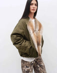 Three-quarter model view of Fireladyfur Hull Contract Army Green fur collar down parka