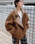 Woman styling the Jazz Party brown Merino shearling jacket outdoors
