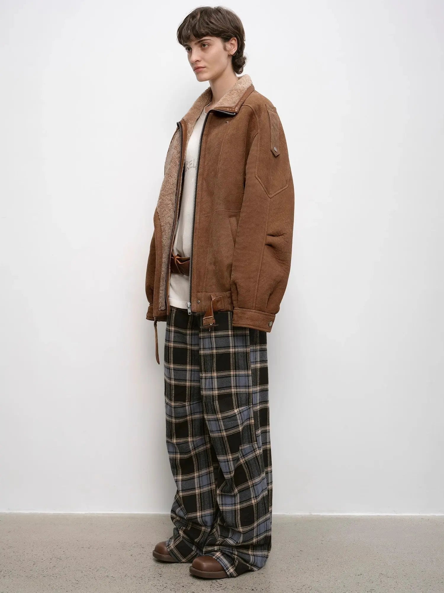 Woman styling the Jazz Party brown shearling jacket, three-quarter view