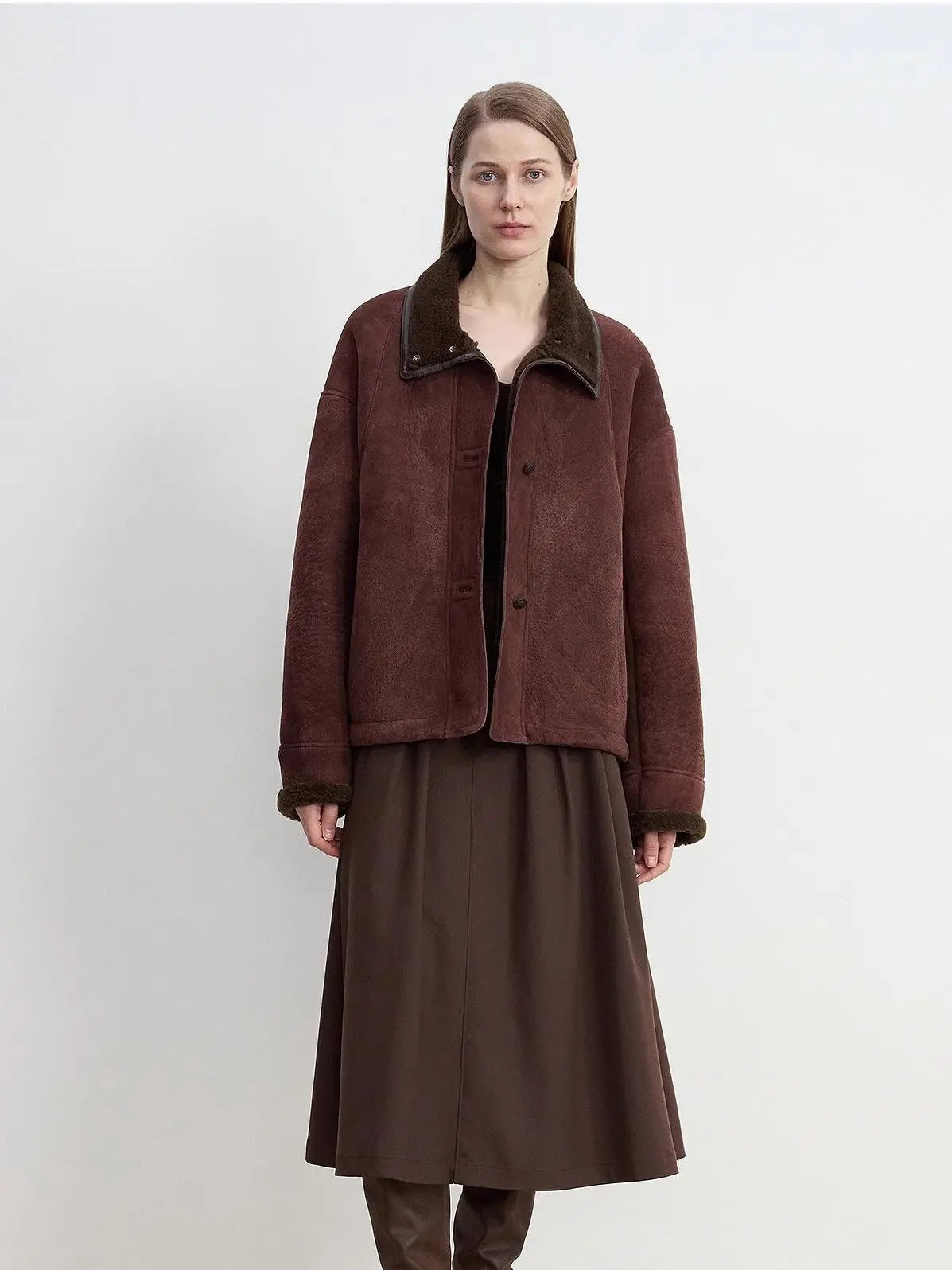 Model wearing the Knight's Contract reddish brown Merino shearling coat