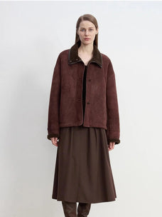 Model wearing the Knight's Contract reddish brown Merino shearling coat