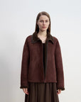 Knight's Contract reddish brown shearling winter coat styled on model
