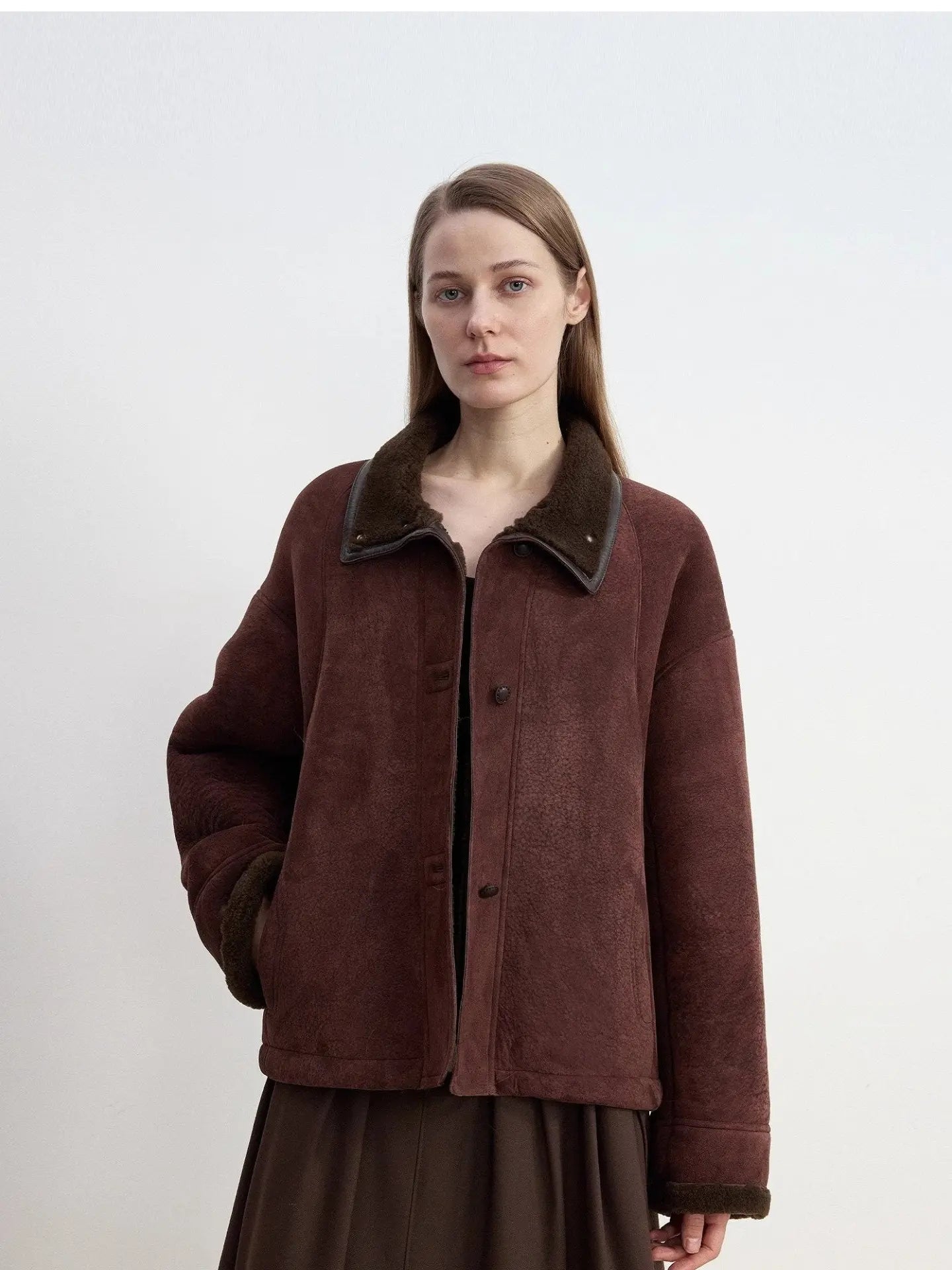 Model view of reddish brown Merino shearling fur collar coat