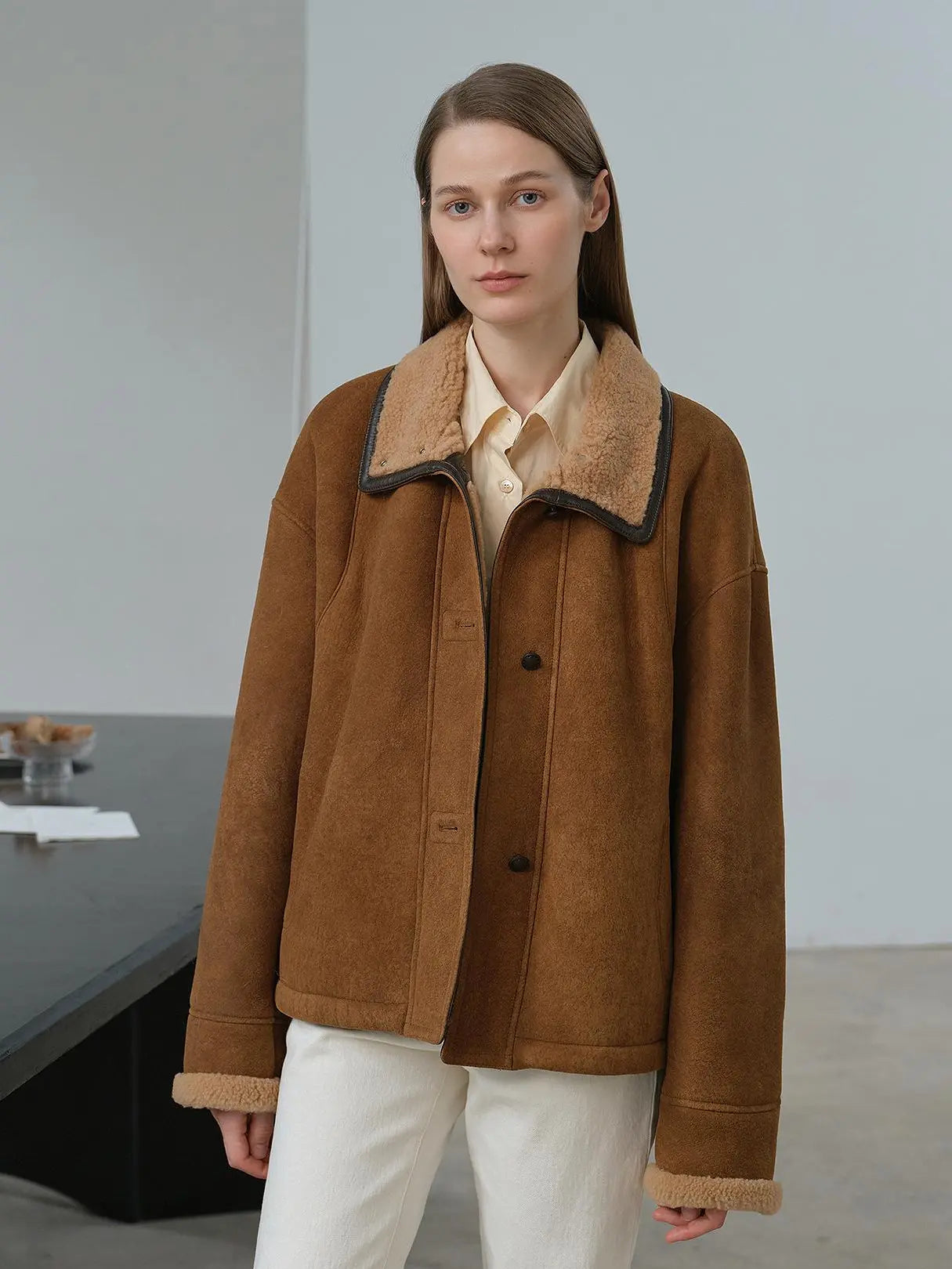 Model wearing the Knight's Contract yellowish brown Merino shearling coat