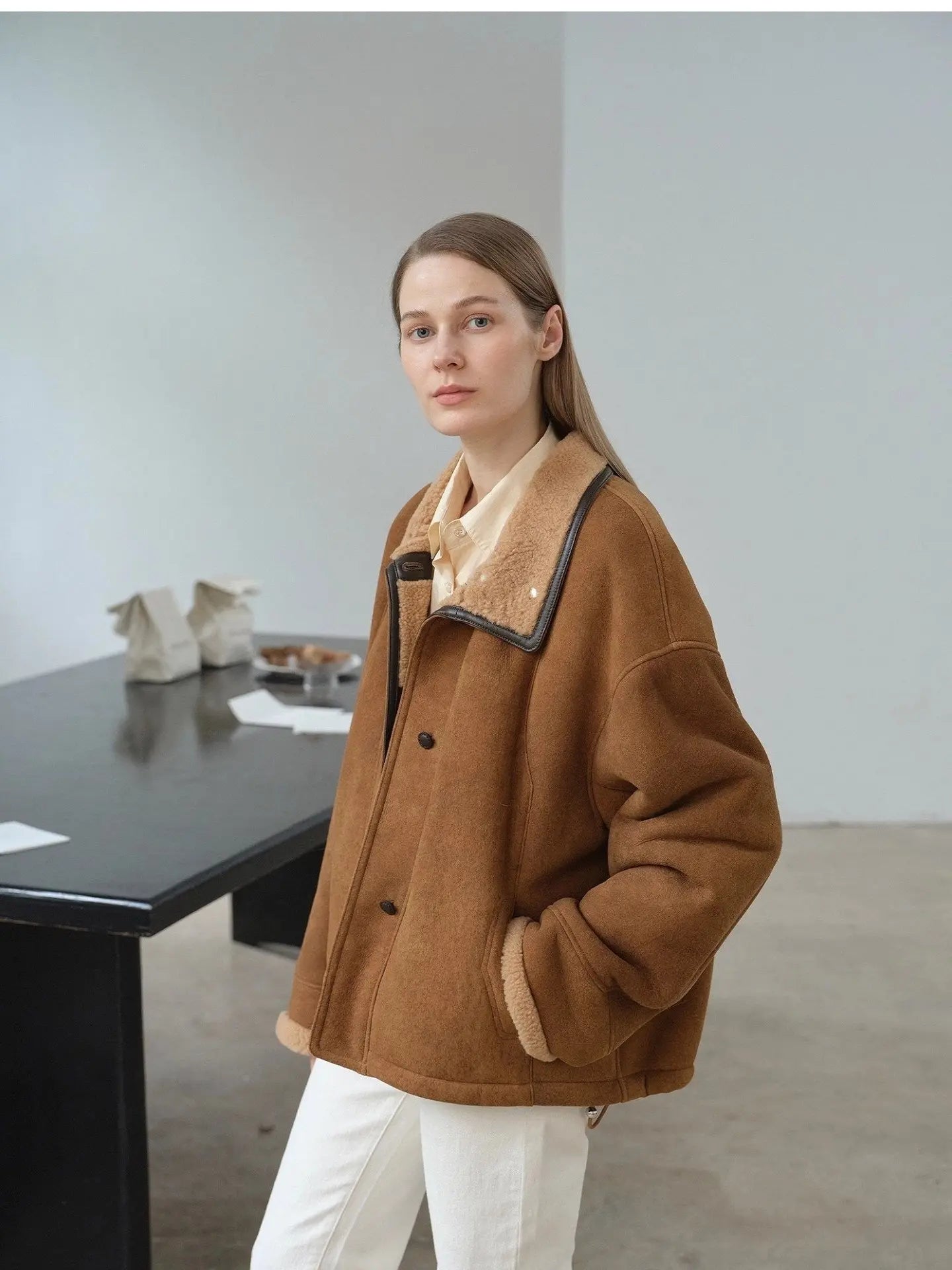 Yellowish brown shearling coat showing structured winter silhouette