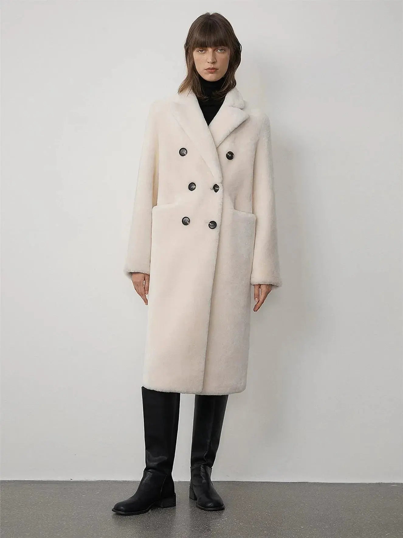 Woman wearing the Korean Drama Ace off-white Merino shearling coat, front view
