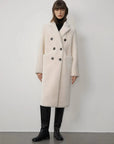 Woman wearing the Korean Drama Ace off-white Merino shearling coat, front view