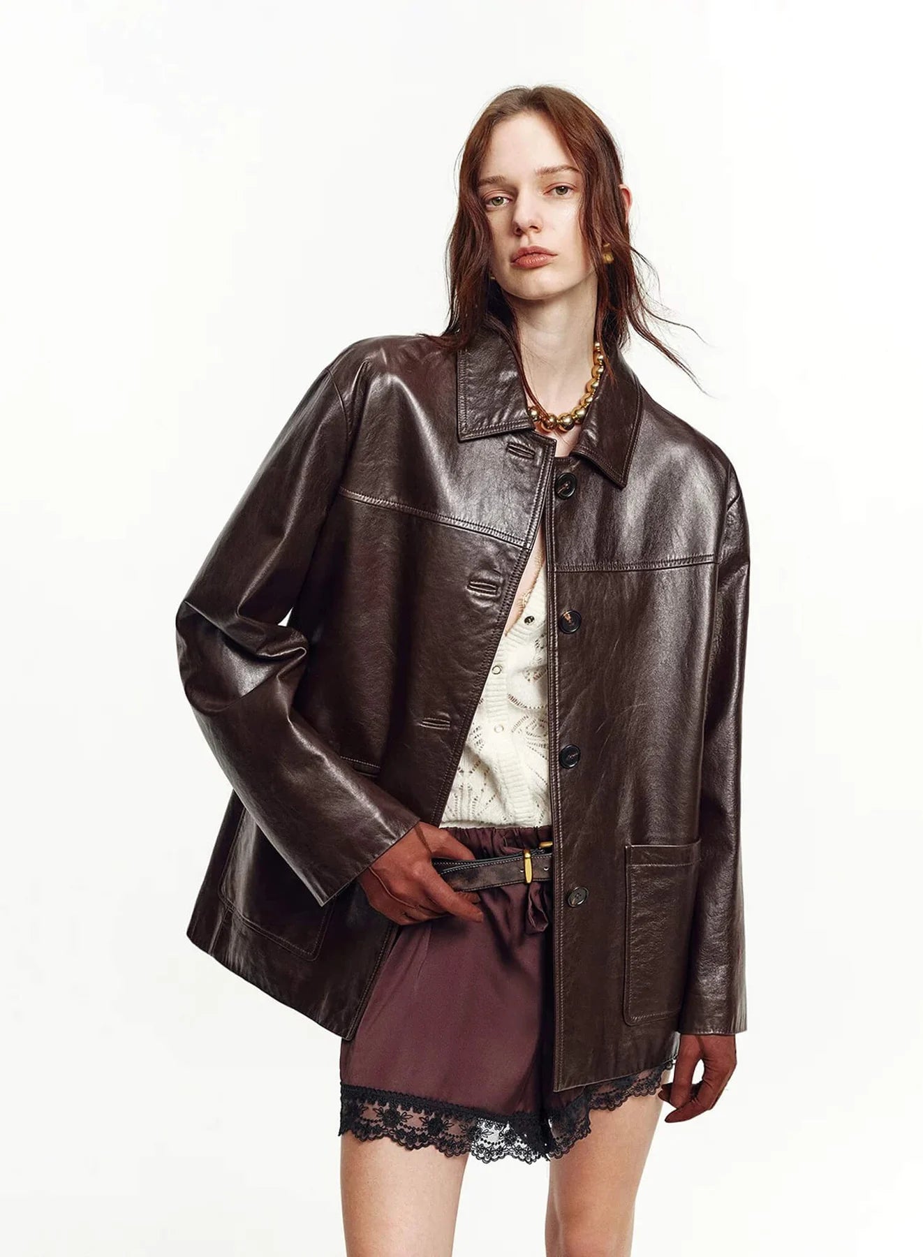 Woman wearing a relaxed brown leather jacket