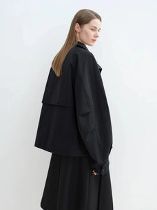 Side view of black Letrans Silent Trace parka with relaxed raglan sleeve