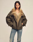 Model wearing Firelady Fur The Long Night Is Coming Greenish-Brown wolf fur parka front view