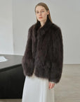 Long Nocturne black Saga fox fur coat side model view