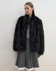 Long Nocturne reddish brown Saga fox fur coat on model