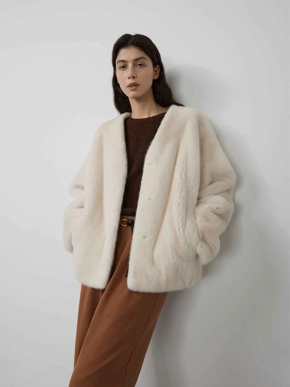 Model wearing Fireladyfur Louvre Pearl Natural mink V-neck jacket front view