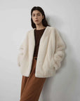 Model wearing Fireladyfur Louvre Pearl Natural mink V-neck jacket front view
